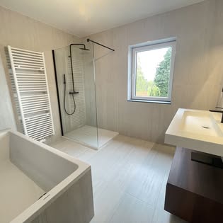 Bright bathroom with a bathtub and shower