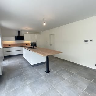 Open kitchen with a wooden central island