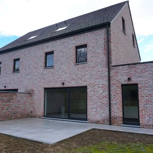 Rear facade and terrace of a brick house